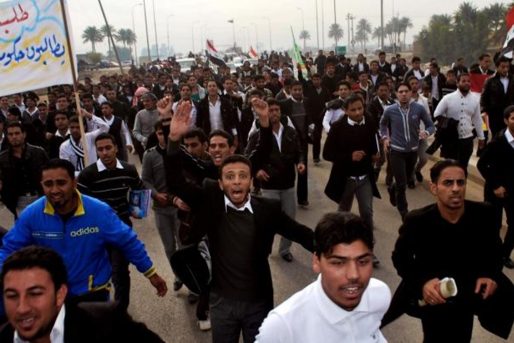 Iraqi protesters blocked a road to Syria and Jordan. Photo: AP