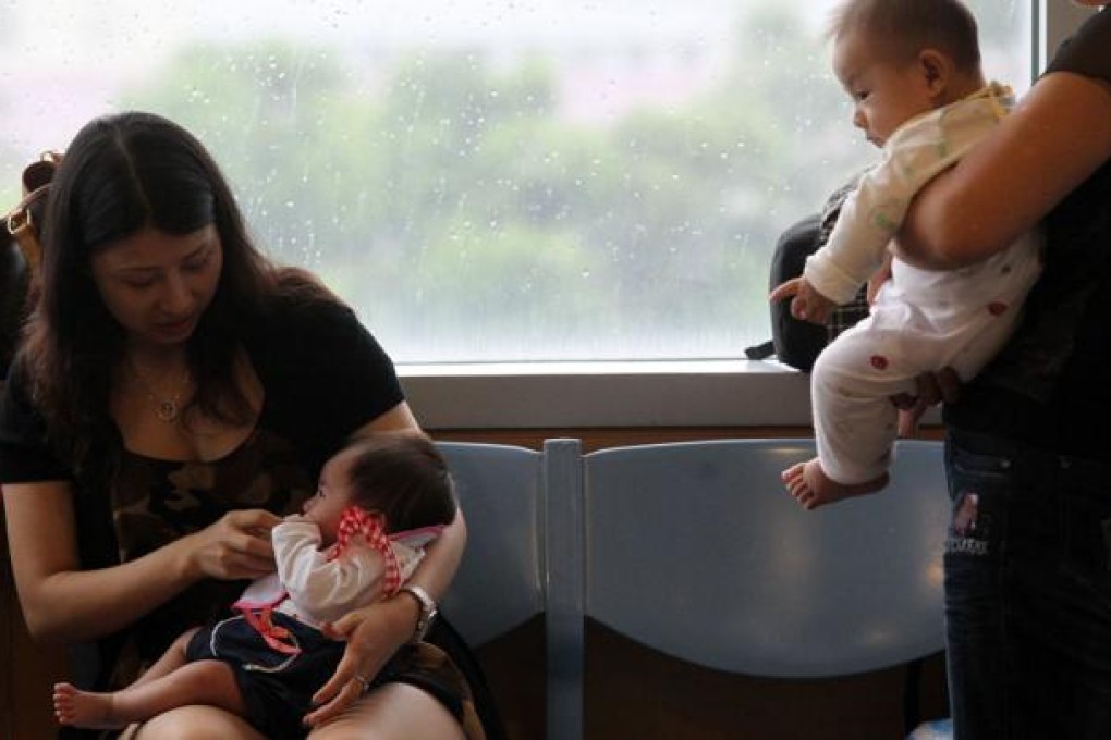 Mainland agencies who help pregnant women from across the border to reserve maternity bed spaces in Hong Kong claim they will still be able to do so after the "zero-birth quota" comes into effect. Photo: Dickson Lee