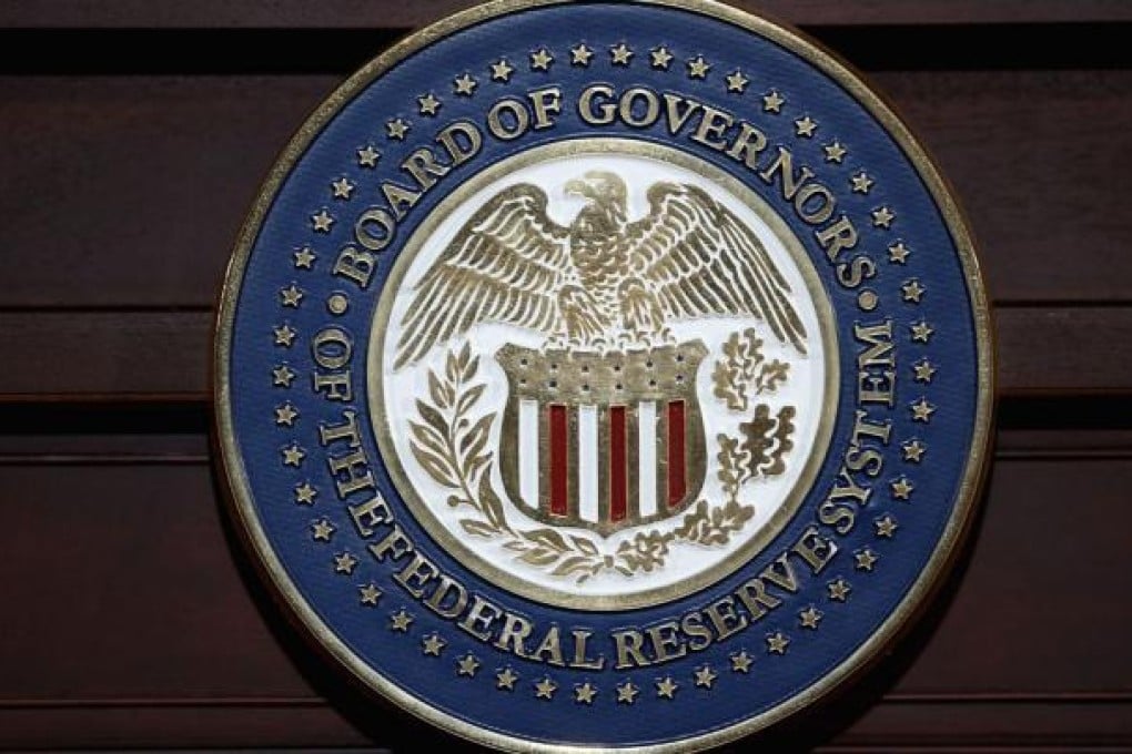 US Federal Reserve must keep interest rates low for a while longer. Photo: AFP