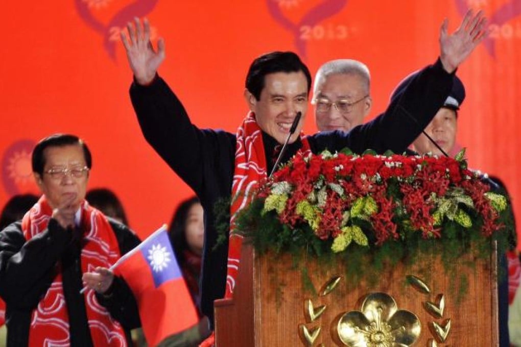 Ma Ying-jeou waves to the crowd during a flag-raising ceremony at the Presidential Office Square in Taipei yesterday. Photo: AFP