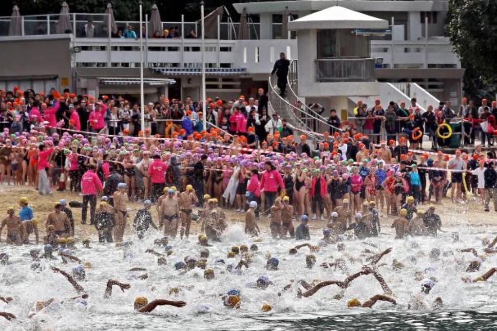 Competitors set the South China Sea churning during the 37th annual swimming race at Repulse Bay yesterday. Photo: Edward Wong