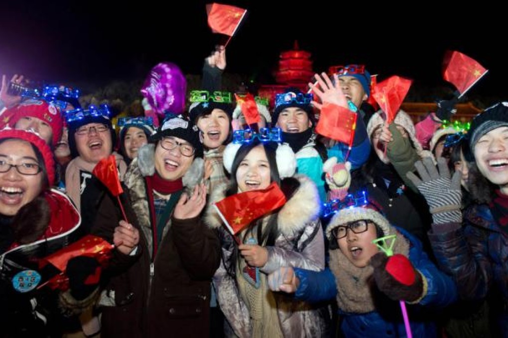 Revellers celebrate the new year during a count-down event at the Summer Palace in Beijing. Photo: AFP