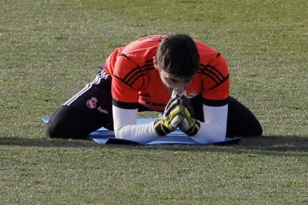 Real Madrid keeper Iker Casillas limbers up during a training session. Photo: EPA