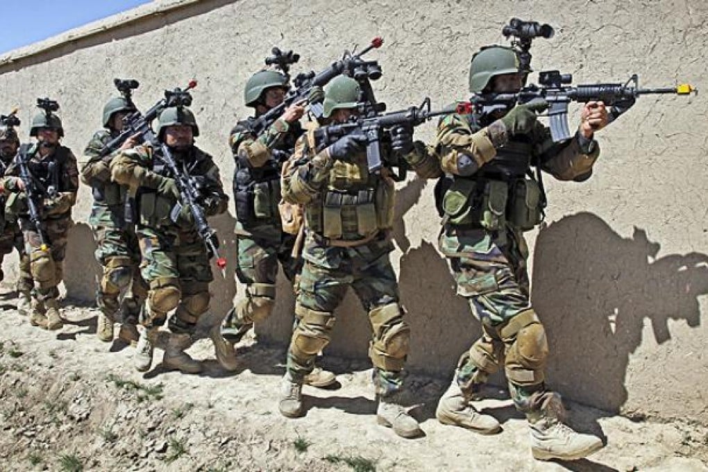 Afghan special forces trained by US soldiers demonstrate a raid for rescuing a hostage at the commando training centre in Kabul. Photo: AP