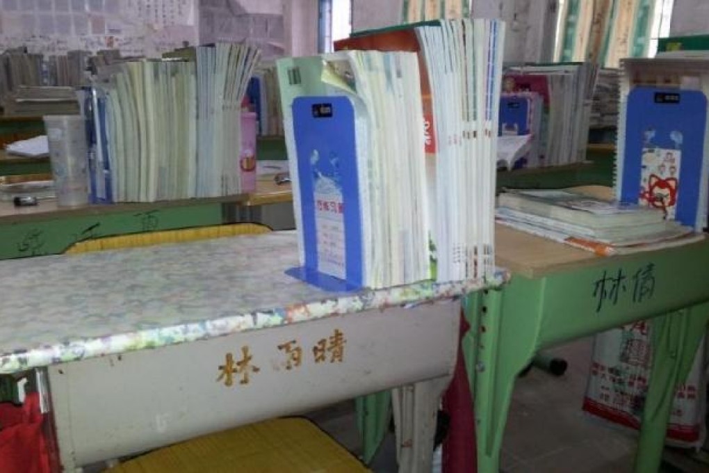 Desks at the Zhenwen Central Primary School with their owners' names etched onto the front. Photo: SCMP Pictures