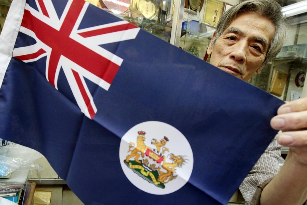 Wong Ying-kui, 72, reminds youngsters buying colonial flags from his Yau Ma Tei shop of Hong Kong's subjection to colonial powers. Photo: KY Cheng