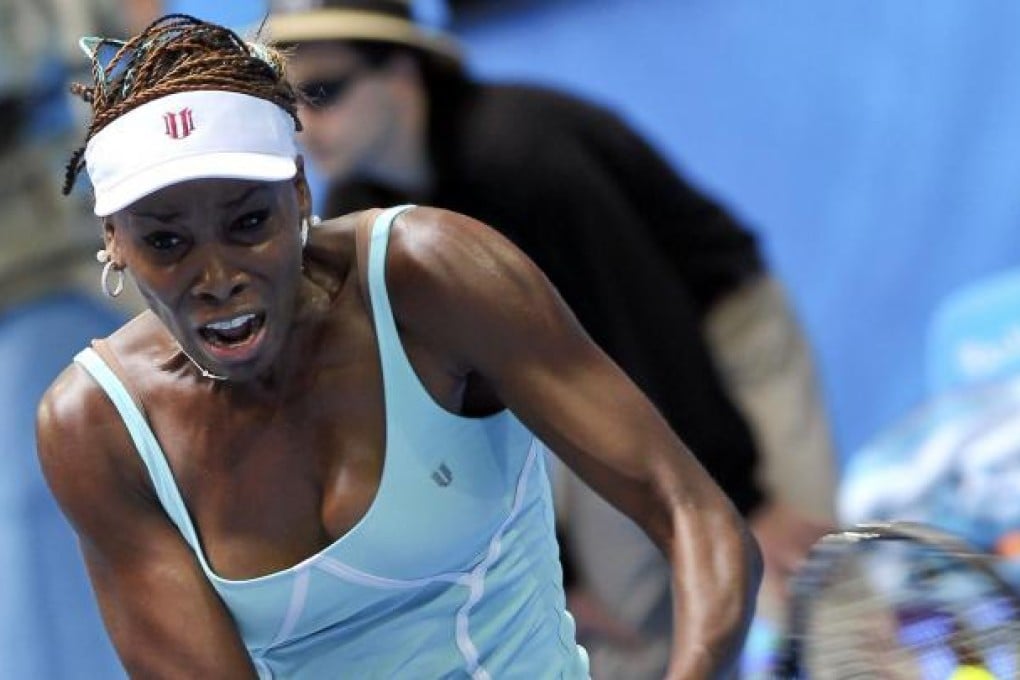 American Venus Williams hits a return against Anabel Medina Garrigues, of Spain, in their Hopman Cup match. Photo: AFP
