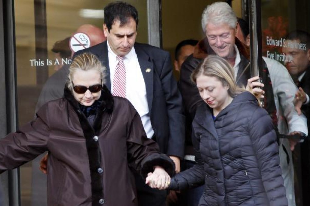 Hillary Clinton leaves New York Presbyterian Hospital with husband, Bill (top right), and daughter Chelsea (right). Photo: Reuters