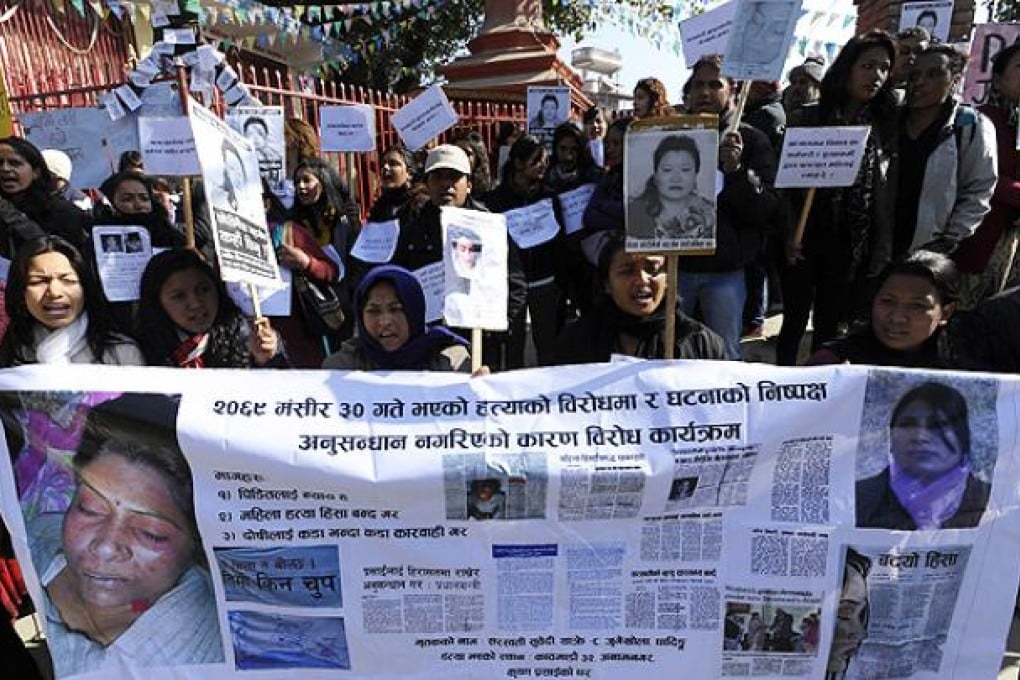Nepalese activists shout slogans as they march near the Prime Minister's residence in Kathmandu on Thursday, during a protest demanding justice in rising cases of violence against women. Photo: AFP