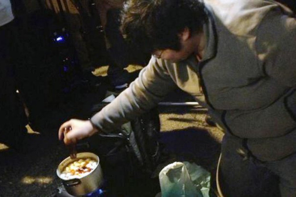 Protesters in the march against Chief Executive Leung Chun-ying on Tuesday cooked spicy fish balls on Pedder Street. Photo: Colleen Lee