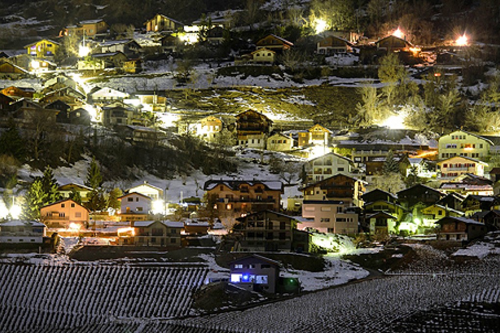 The Swiss village of Daillon, early on Thursday, where a gunman killed three people and wounding two others. Photo: AFP