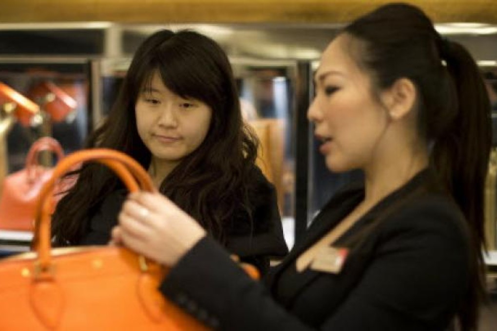 Mainland shoppers buying consumer goods over Christmas. A new survey on Friday said consumer sentiment in China dipped slightly in December. Photo: AFP