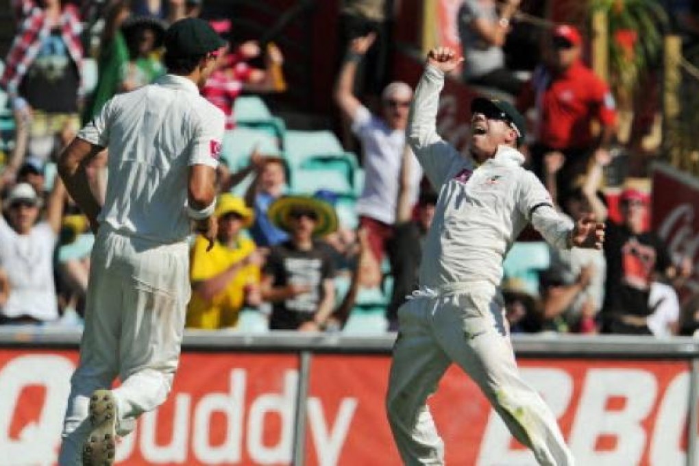 Australian fieldsman David Warner (right) playing against Sri Lanka. Photo: AFP