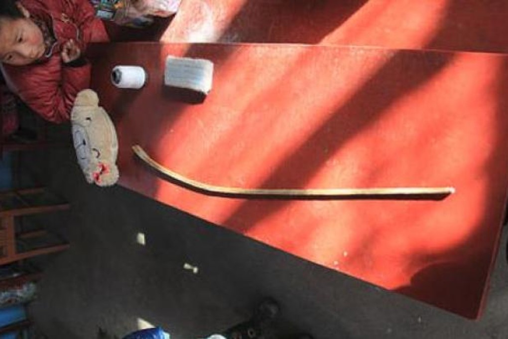 The metre-long stick pictured on a classroom desk which the teachers allegedly used to beat the child. Photo: SCMP Pictures