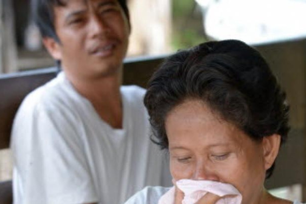 Relatives grieve over their grand children, victims of a gunman who killed at least five people and wounded 11 near Manila. Photo: AFP