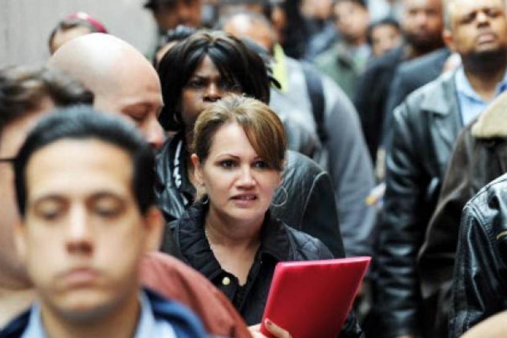 People seeking jobs  at an employment fair in New York. Photo: AFP