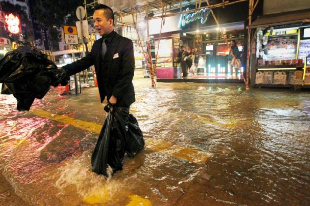 A fresh water pipe burst beneath Tin Lok Lane, Wan Chai yesterday.