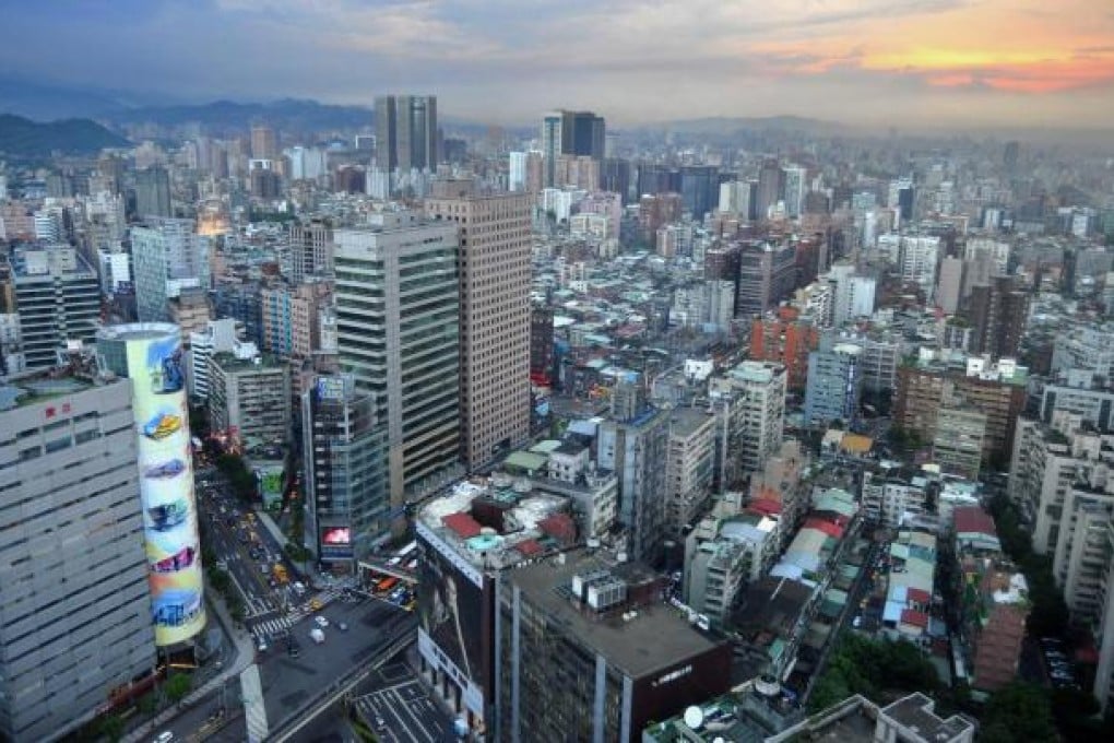 To head off real estate speculation, Taiwan's government restricts mainland investors from buying property on the island. Photo: AFP