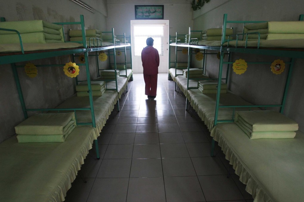 A woman in her dormitory at a re-education through labour centre in Jiangsu province in 2008. Photo: Imaginechina