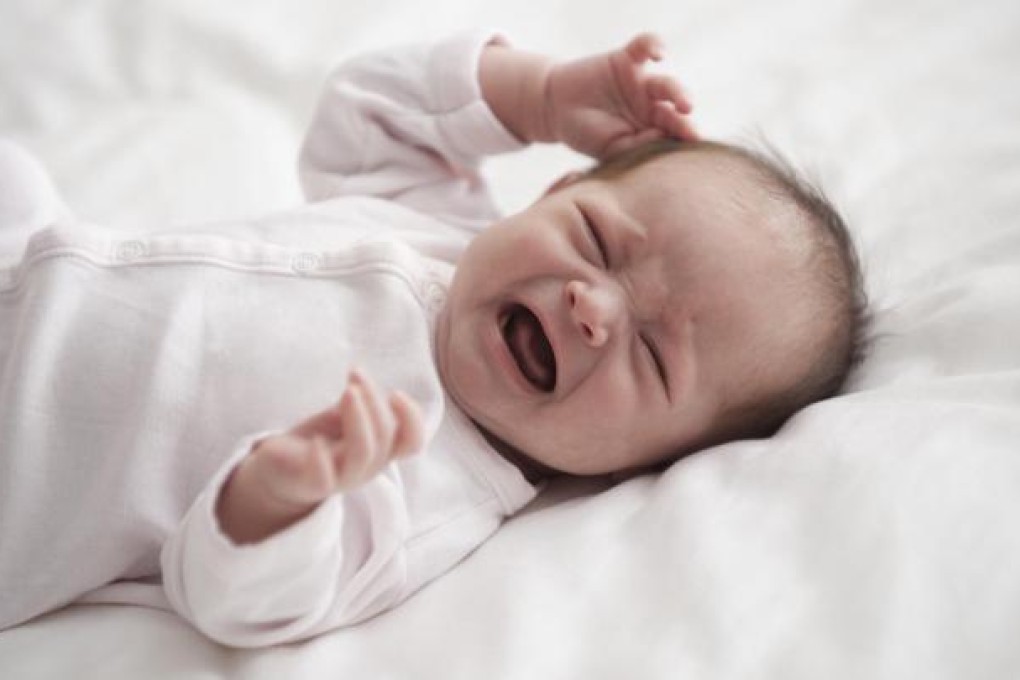 Infants who wake up crying in the middle of the night are best left to self-soothe and fall back to sleep on their own. Photo: Corbis
