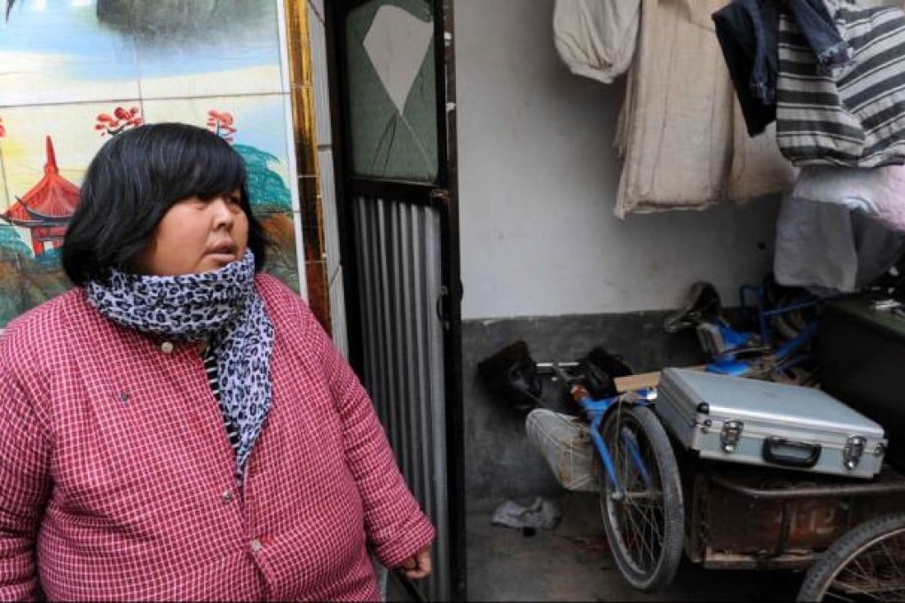 Yuan Lihai, the owner of the adoptive family suffering from fire accident. Photo: Xinhua