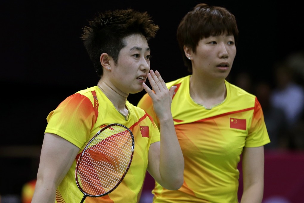 Yu Yang, left, and Wang Xiaoli talk during a women's doubles badminton match at the London Olympics on Tuesday, July 31, 2012. Photo: AP