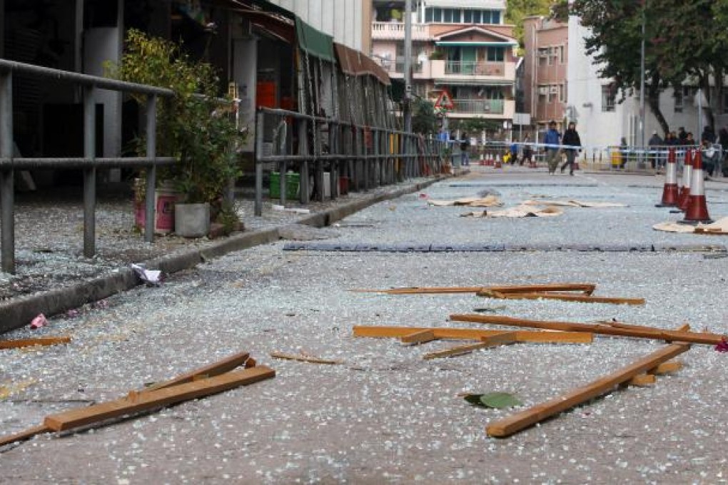 The gas explosion shattered windows, showering the street below in glass shards. Photo: May Tse