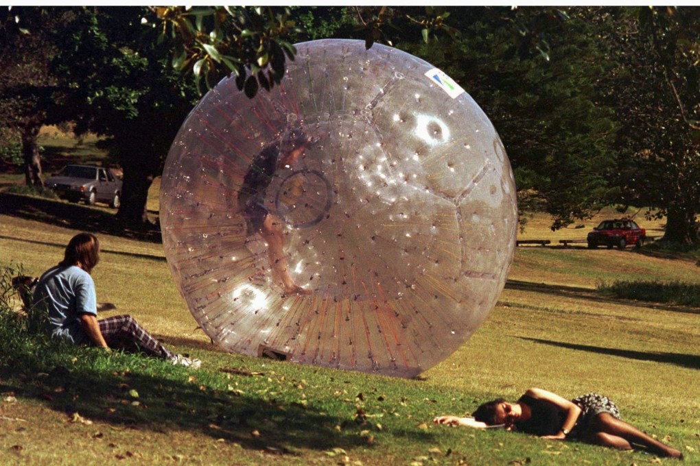 Inventor David Akers rolls inside a ‘Zorb’, down a Sydney hill. Zorbs can reach speeds of up to 50 kilometres per hour, but a tragedy in Russia this week has highlighted the risks involved in the sport. Photo: Reuters