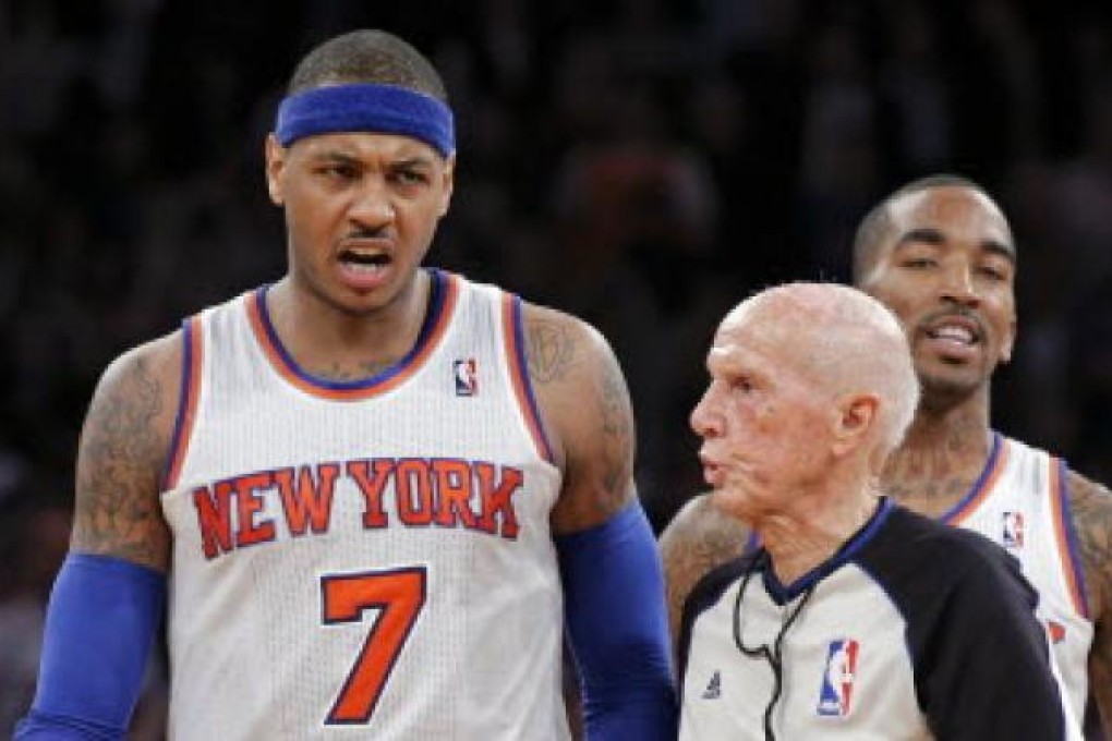 Referee Dick Bavetta (right) and New York Knicks forward Carmelo Anthony. Photo: AFP