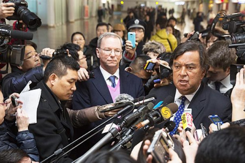 Google executive chairman Eric Schmidt (left) and Bill Richardson arrive at Beijing airport after their trip to Pyongyang. Photo: EPA