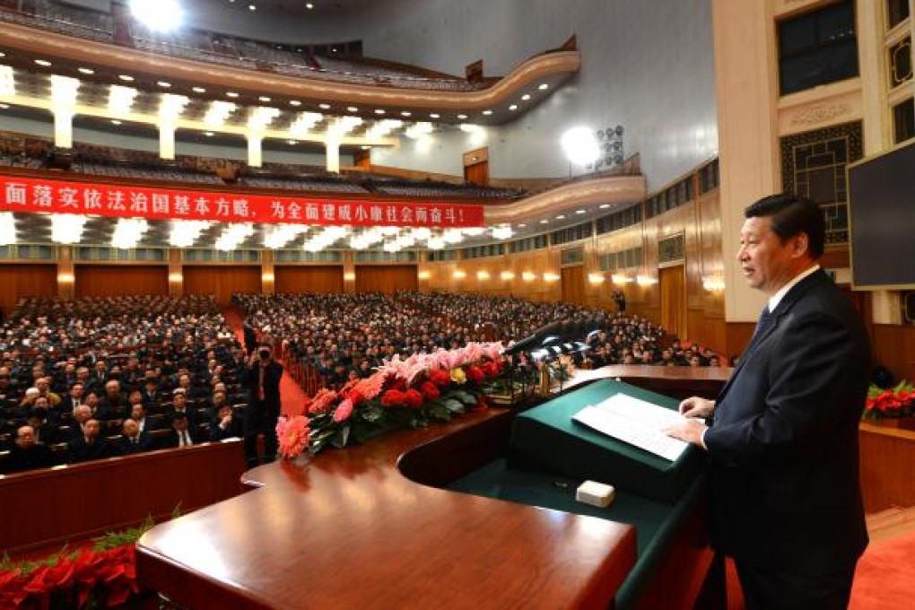 Xi Jinping (right) speaks at a congress marking the 30th anniversary of the Constitution's implementation in Beijing. Photo: Xinhua