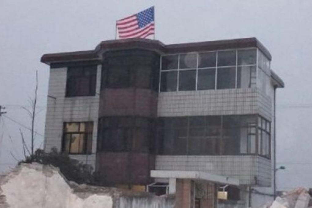 A US flag flying from the top floor of a village home in Taizhou city, Jiangsu. Picture: SCMP Photos and Weibo.