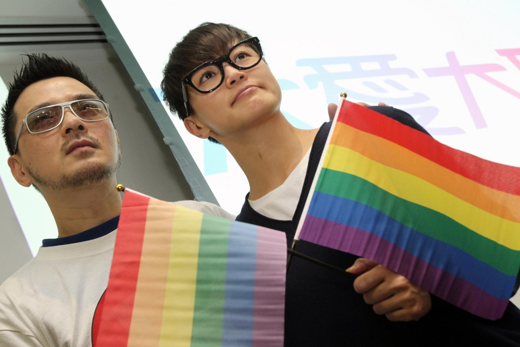 Singers Anthony Wong Yiu-ming and Denise Ho Wan-sze show their support at the launch of the "Big Love" gay rights campaign at the Legislative Council in Tamar, Admiralty, yesterday. The campaign, which will span 18 months, aims to educate the public on a sexual minorities discrimination law, which gay rights groups have called on Chief Executive Leung Chun-ying's administration to introduce. Photo: K. Y. Cheng