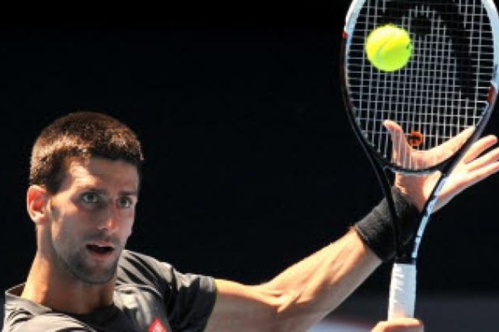 Novak Djokovic of Serbia hits a return during a practice session for the upcoming Australian Open tennis tournament in Melbourne. Photo: AFP