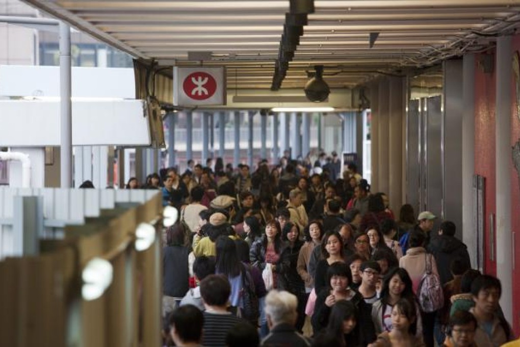 Commuters move through MTR station in Tsuen Wan. Photo: Bloomberg