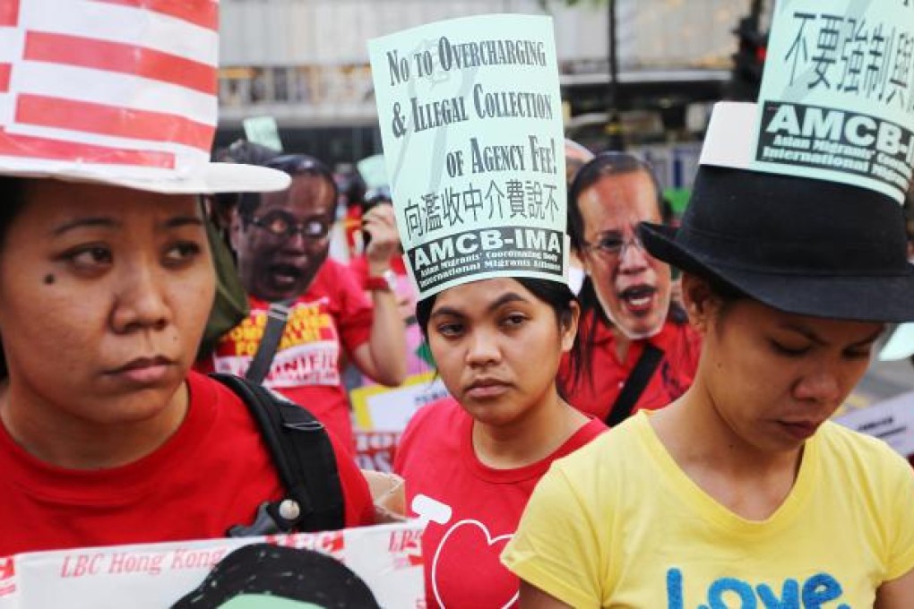 Maids hold placard march on International Migrants Day from Chater Road to Philippine Consulate and Central Government Offices. Photo: Sam Tsang