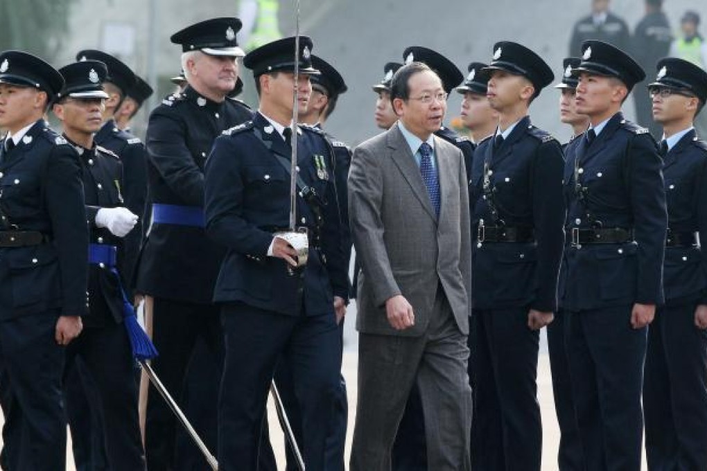 Secretary for Security Lai Tung-kwok reviews the police passing-out parade yesterday. Photo: K. Y. Cheng