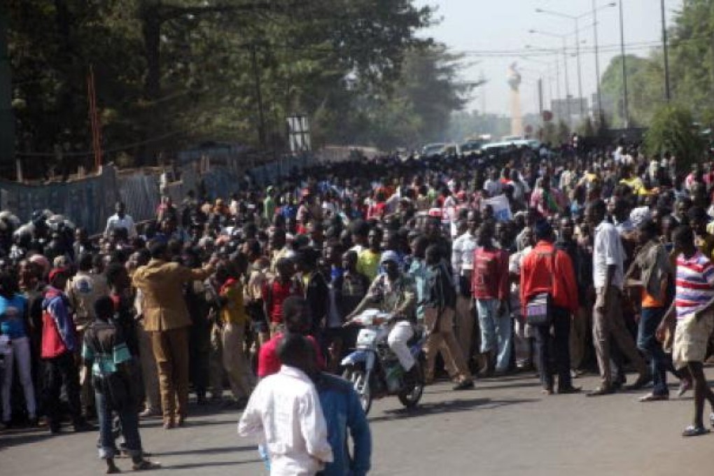 People gather as they take part in a sit-in on January 9, 2013 in Bamako to ask for ''immediate days of sovereign consultation'' on the transition in Mali. Photo: AFP