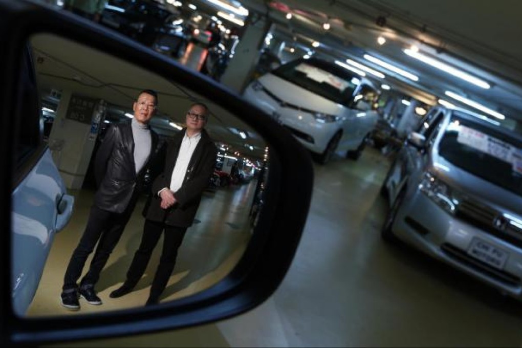 Automall's Henry Au, left, and consultant Kelvin Leung.