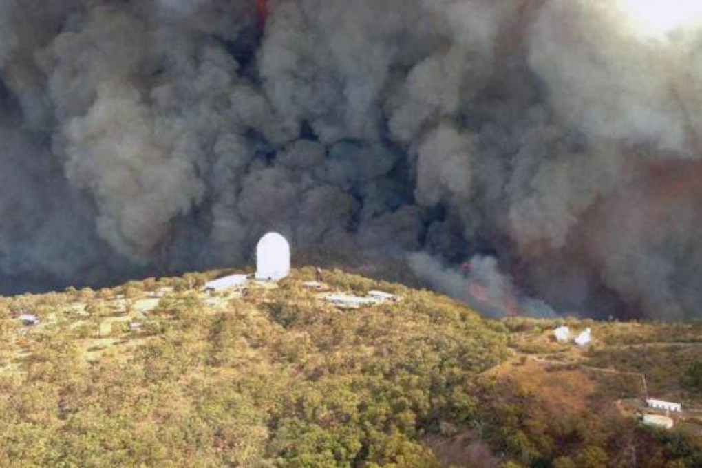 Fires approach the Siding Spring Observatory yesterday. Photo: AFP