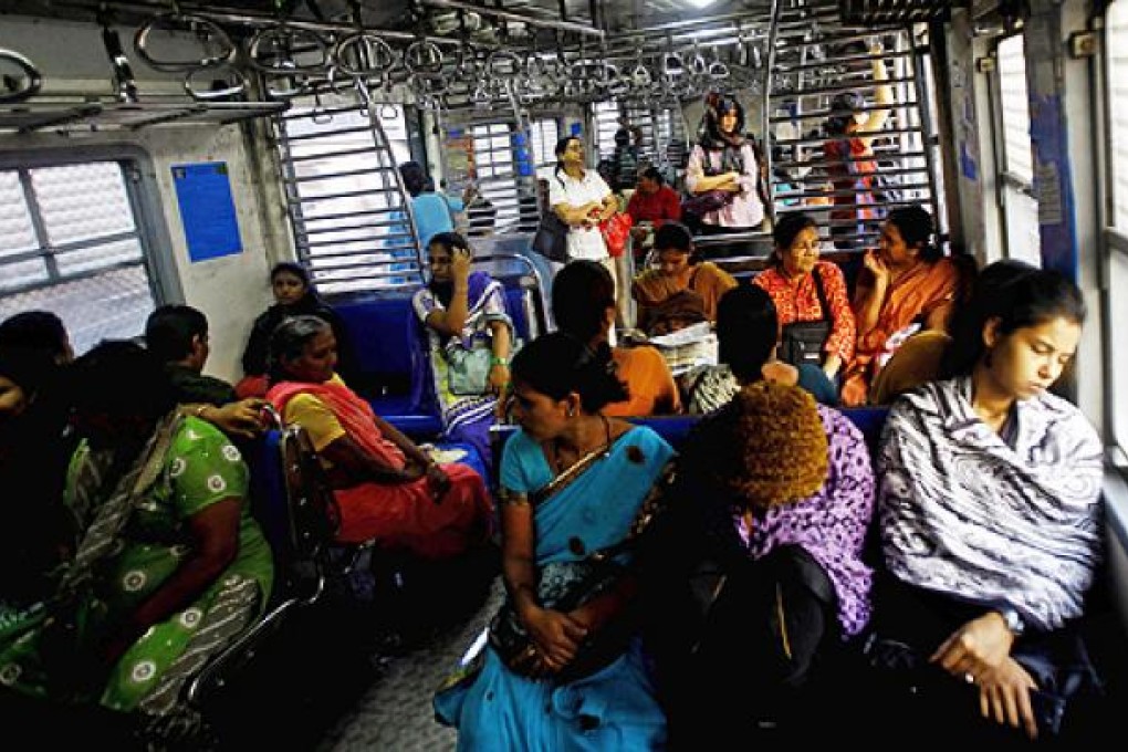 Passengers travel in the women's compartment of a train in Mumbai on Thursday, as a gang-rape case has fuelled anger across India over the treatment of women. Photo: AP