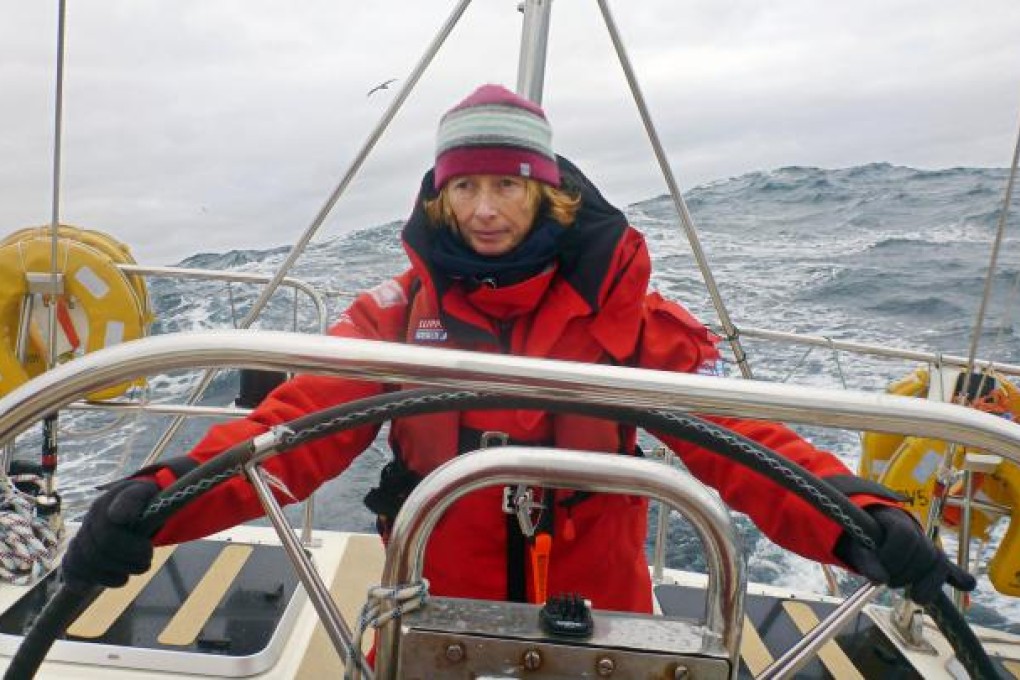 Barbara Yendell, who sailed round the world as a novice, at the helm.Photo:Barbara Yendell