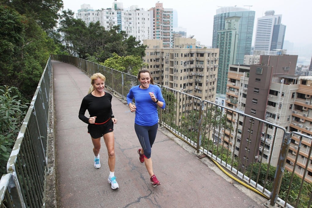 Laura Walsh (left) helps writer Rachel Jacqueline regain some spring in her step along the Bowen Road jogging track in Mid-Levels.Photo: Dickson Lee