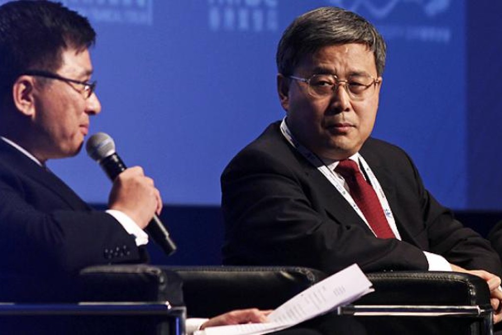 Guo Shuqing (right), chairman of the China Securities Regulatory Commission, at the Asia Financial Forum. Photo: Sam Tsang