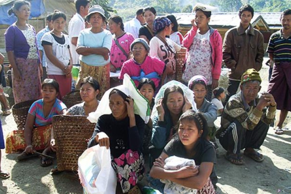 Kachin refugees wait for rations at Je Yang IDP camp, near Laiza, in northeastern Myanmar. Photo: AP