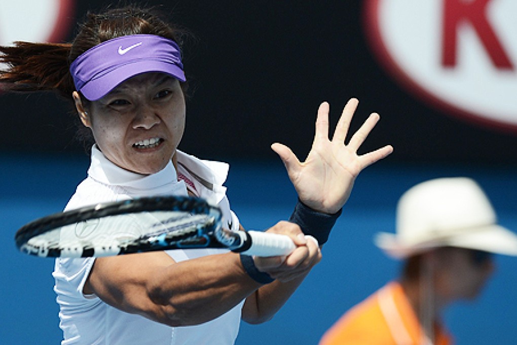 China's Li Na hits a return against Kazakhstan's Sesil Karatantcheva at the Australian Open on Monday. Photo: AFP