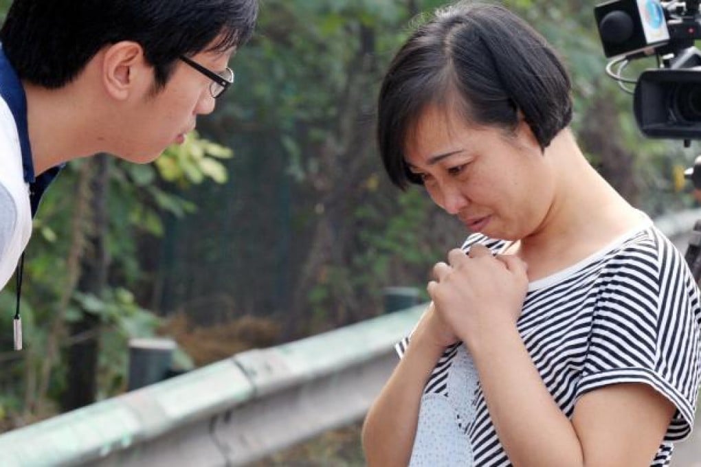 Tang Hui, a mother of underage rape victim, talks to a reporter after being released from a labour camp on Aug. 10, 2012.  Photo: Xinhua