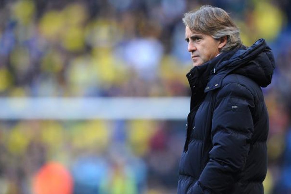 Manchester City manager Roberto Mancini. Photo: EPA