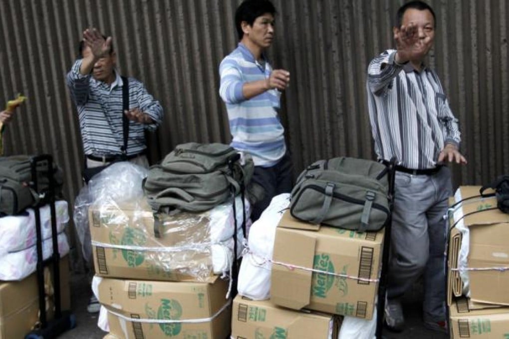 Only five in 100 mainland visitors from Shenzhen are "genuine" tourists. Photo: EPA