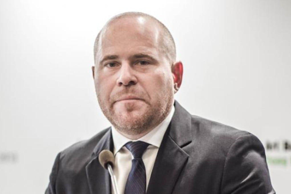 Art Basel director Marc Spiegler addresses a press conference in Hong Kong on Tuesday. Photo: AFP